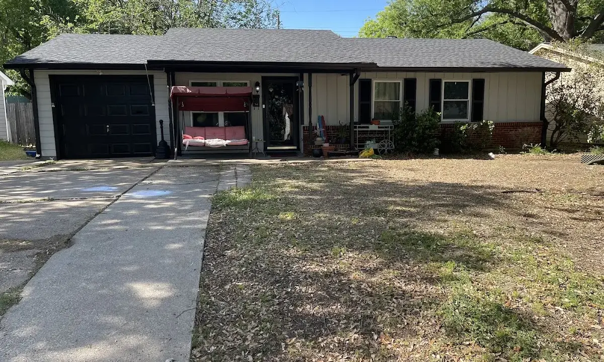 Wind Damage Roof Repair crew at work on a residential roof in Gainesville